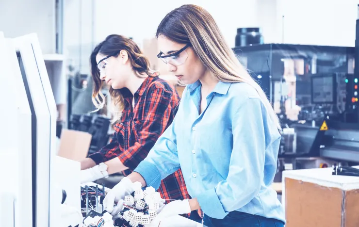 Two womens in a repair center_Collect of cables.png